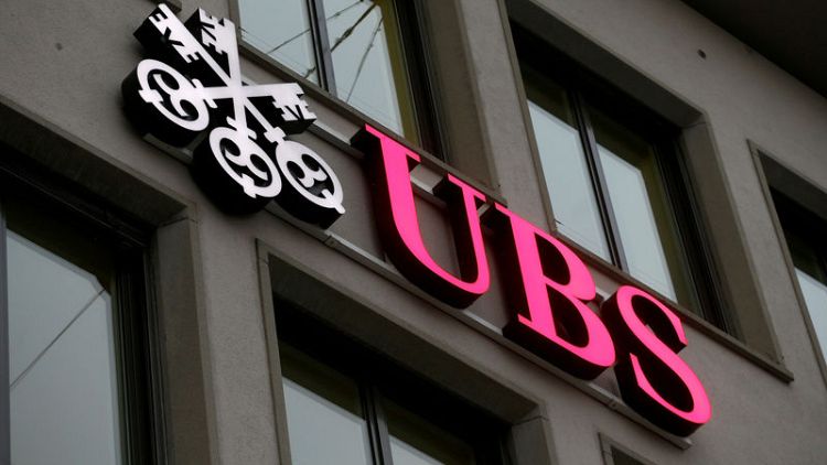 UBS tightens investment banking belt as earnings slide continues