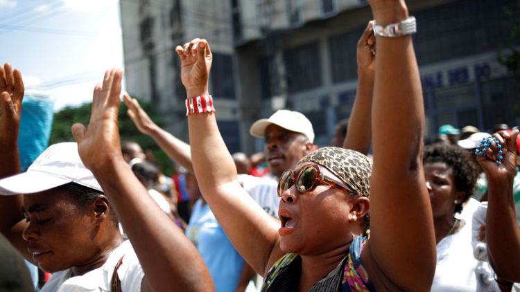 Haitian Catholics march for political reform as protests spread