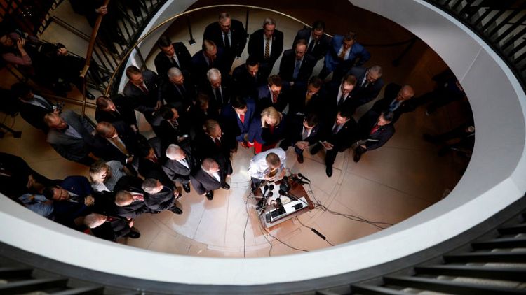 Republican lawmakers storm hearing room, disrupt Trump impeachment inquiry
