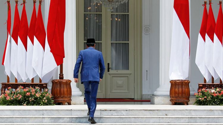 Widodo's gamble: Indonesia president includes fierce rival in cabinet