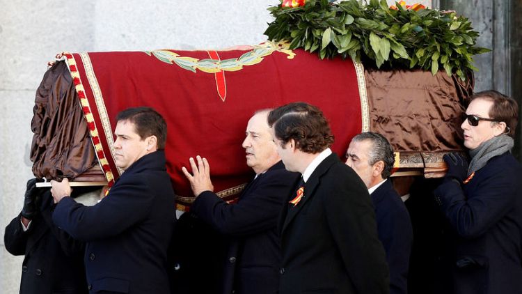 Behind closed doors, Spain exhumes Franco's remains