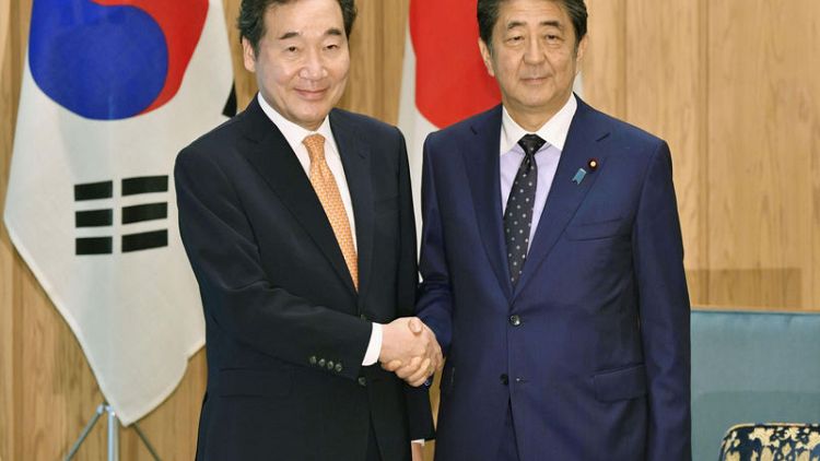 Japan's Abe renews call on South Korea to keep promises as a chance to mend ties