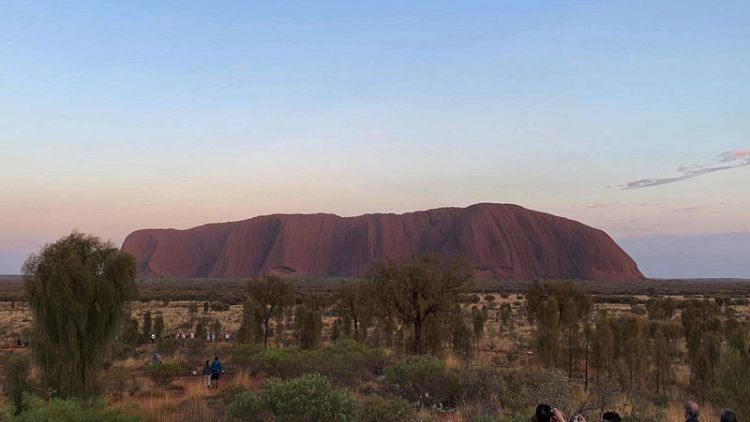 Tourists line up to scale Australia's Uluru hours ahead of climb ban
