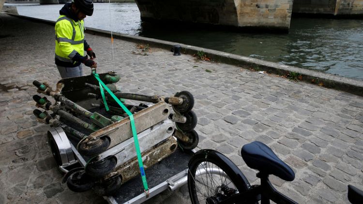 Fishing for scooters in the shadow of the Eiffel Tower