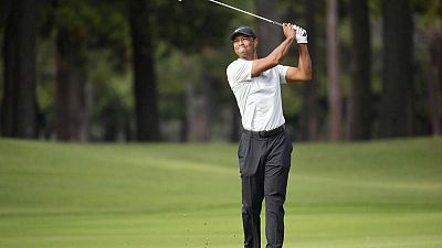 Silence is golden as Woods sneaks two shots clear in Japan Silence is golden as Woods sneaks two shots clear in Japan