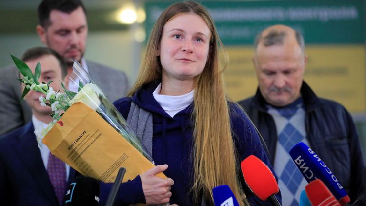 Russian woman convicted by U.S. of being agent returns home