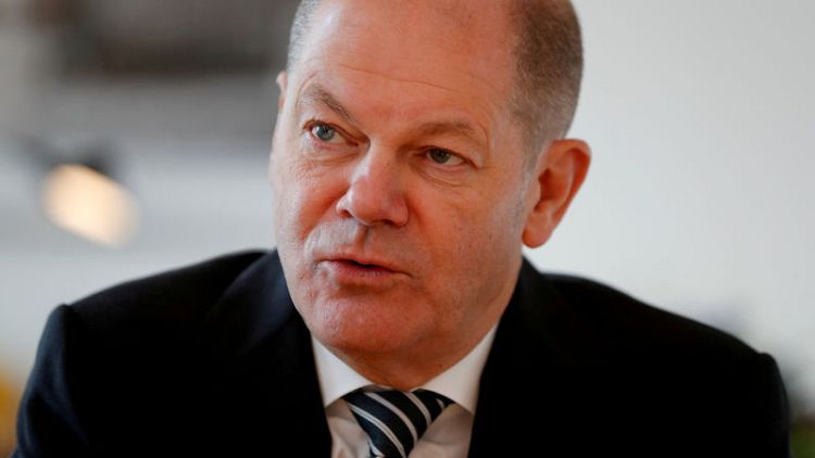 Germany's Scholz tops SPD leader vote, but faces run-off