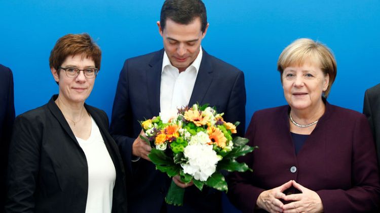 German conservative leader faces rebellion after election trouncing