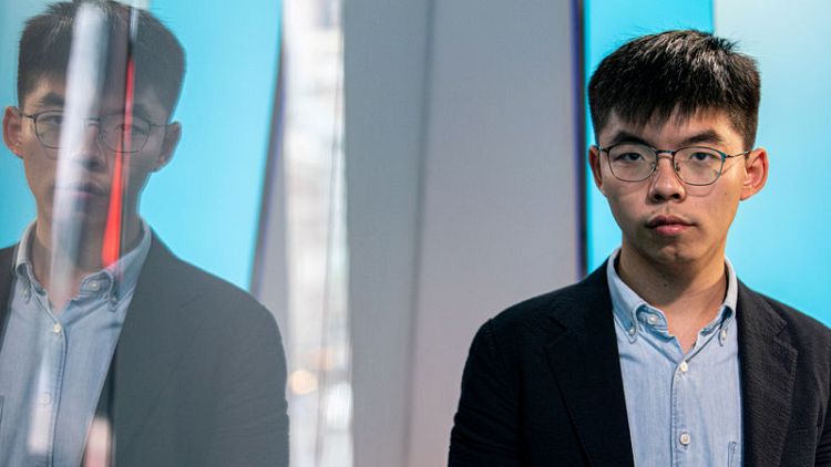 Hong Kong disqualifies democracy activist Joshua Wong from district elections