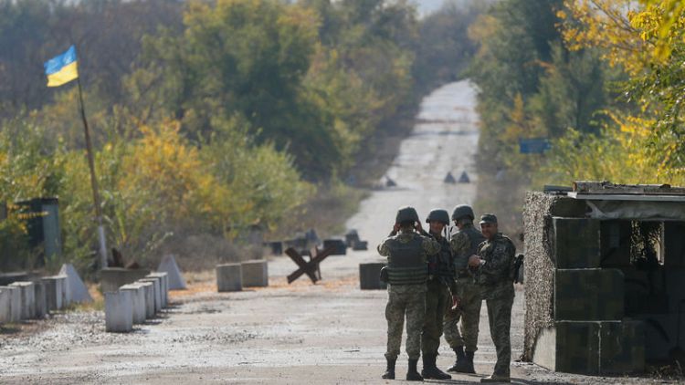 Ukraine starts withdrawal of troops in rebel east