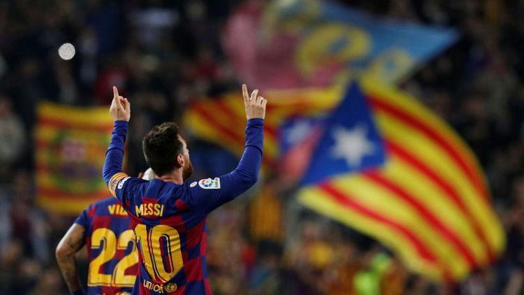 Magical Messi sends Barcelona top in Valladolid rout
