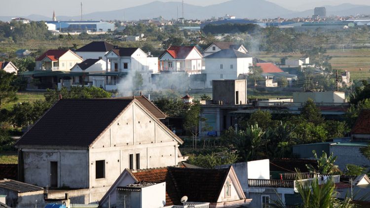 In Vietnam's 'Billionaire Village', migrant cash can buy a palace