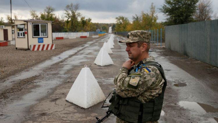 Ukraine plans more troop withdrawals in east ahead of peace talks