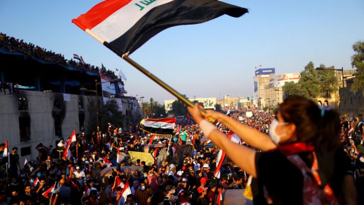 Iraqis pour into streets for biggest protest day since Saddam