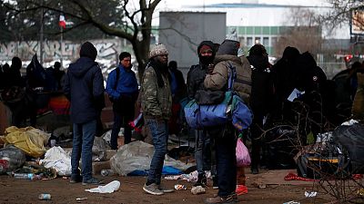 France says to clear some migrant camps by year-end