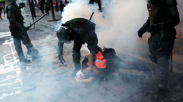 Chile prosecutor seeks to investigate claims of police torture of protesters Chile prosecutor seeks to investigate claims of police torture of protesters
