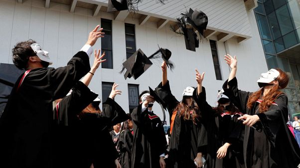 Masked Hong Kong students chant protest slogans at graduation Masked Hong Kong students chant protest slogans at graduation
