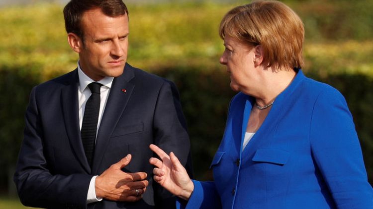 Merkel, NATO chief reject Macron's view NATO is dying