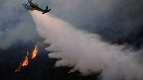 A 'green interest rate?' Fed digs into climate change economics A 'green interest rate?' Fed digs into climate change economics
