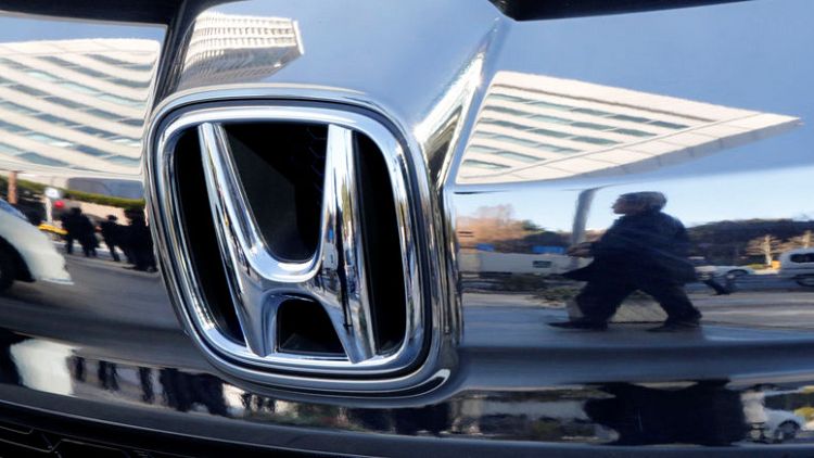 Honda cuts profit, sales outlook to four-year low; unveils $915 million buyback