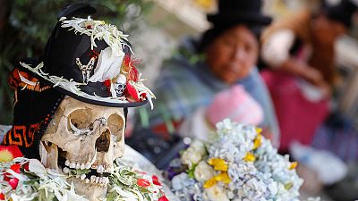 Bolivians turn to Day of Skulls for hope as protests rage
