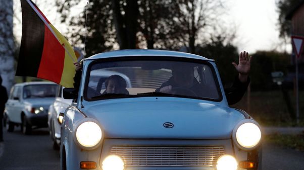 Go, Trabi, go: Germans re-enact fall of Berlin Wall with car parade Go, Trabi, go: Germans re-enact fall of Berlin Wall with car parade