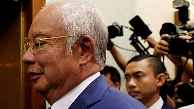 Malaysian court tells former PM Najib to defend himself in 1MDB-linked case