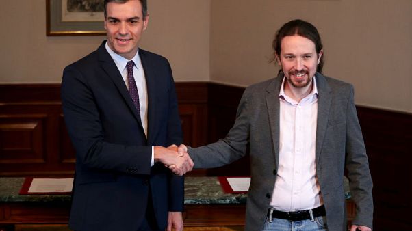 Spain's Socialists and Podemos reach preliminary coalition deal - source Spain's Socialists and Podemos reach preliminary coalition deal - source