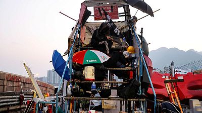 Protesters blockade universities, stockpile makeshift weapons as chaos grips Hong Kong