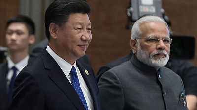 Despite Kashmir anger, China's Xi invites India's Modi to visit again next year
