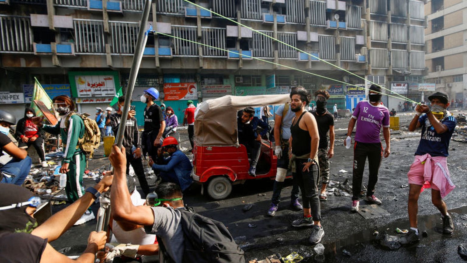 Iraqi forces kill four in Baghdad but protesters stay put - police, medics