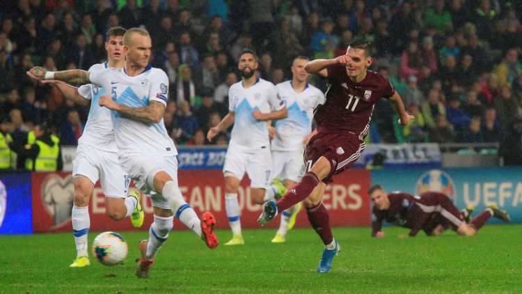 Own goal keeps Slovenia's faint hopes alive