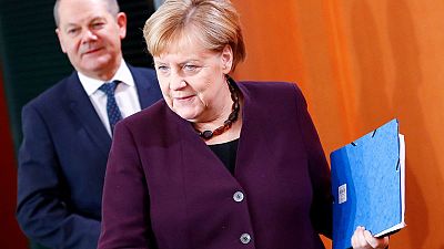 Merkel, Scholz push back against demands for higher public spending