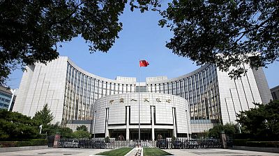 China central bank cuts lending benchmark slightly, as expected