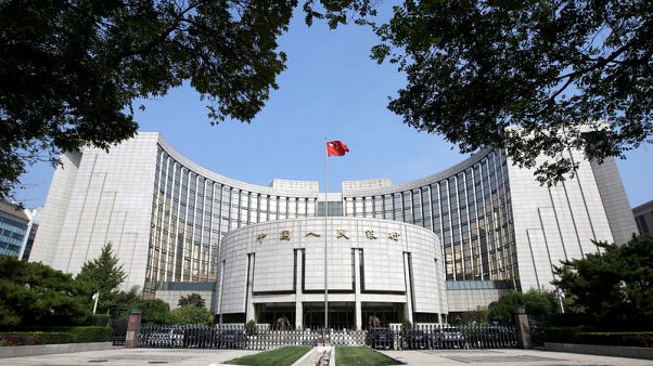 China central bank cuts lending benchmark slightly, as expected China central bank cuts lending benchmark slightly, as expected