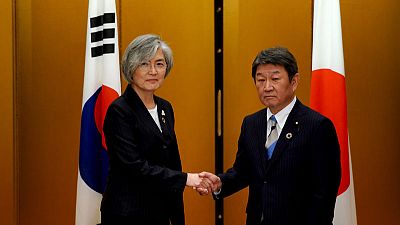 In bid to repair ties, Japan and South Korea agree to summit next month
