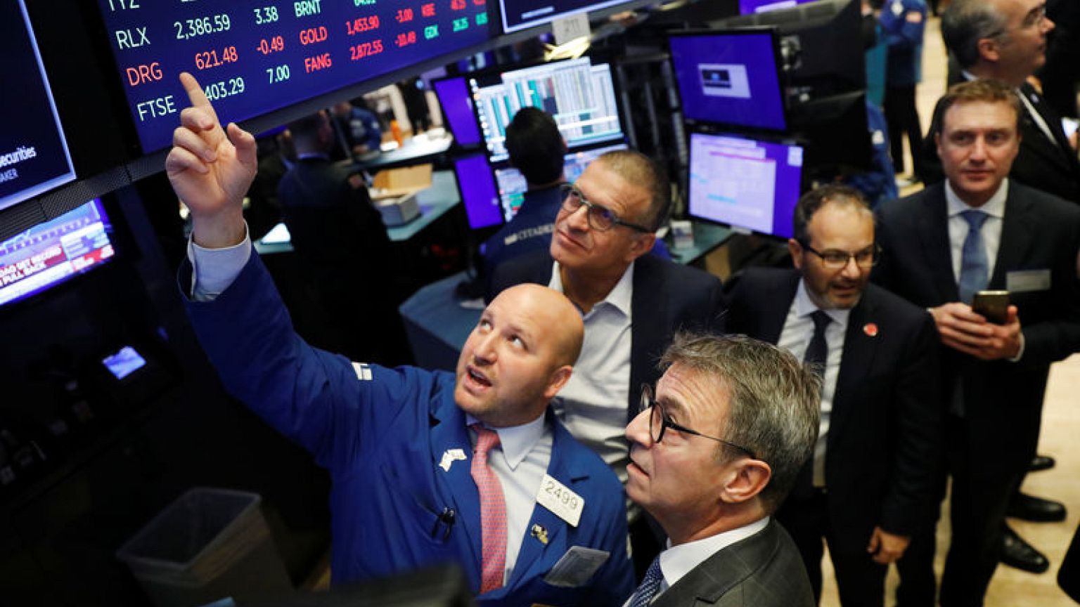 Dollar, global stocks trade mostly flat on trade talk optimism