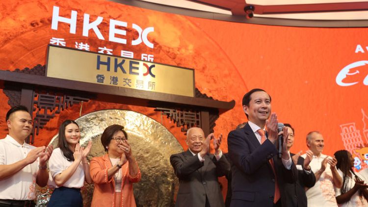 Alibaba's Hong Kong shares mark maiden day of trade with small premium to New York