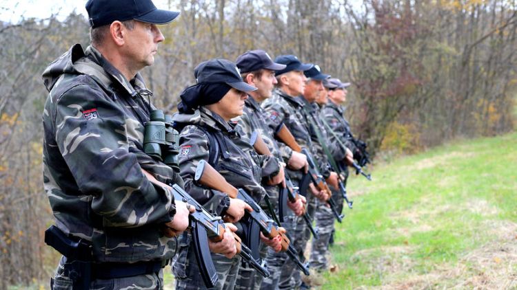 Slovenia backs ban on paramilitary groups after militia patrol border