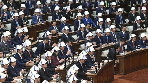 Japan MPs' disaster helmet drill sparks Twitter debate Japan MPs' disaster helmet drill sparks Twitter debate