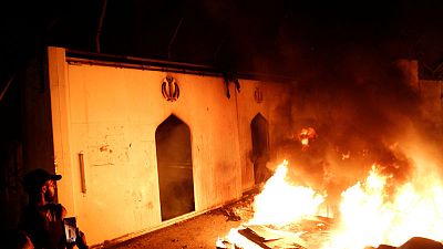 Iraq protesters torch Iran consulate in Najaf, curfew imposed