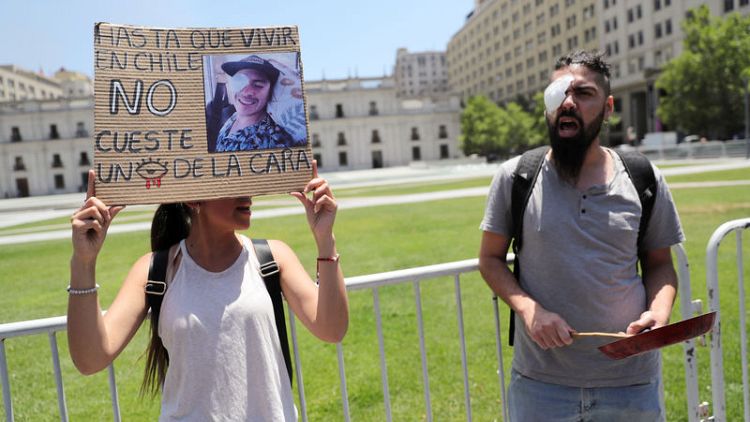 Chileans suffering eye trauma from protests march on presidential palace