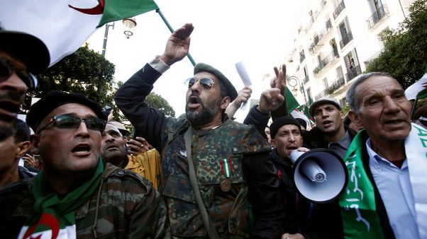 Pro-government supporters rally in Algeria to back planned elections Pro-government supporters rally in Algeria to back planned elections