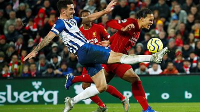 Van Dijk nets double as Liverpool surge 11 points clear