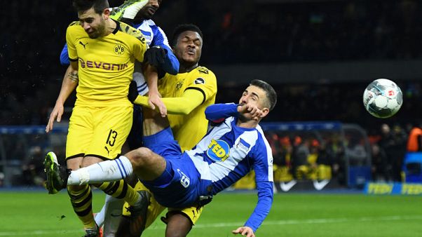 Leipzig go top as 10-man Dortmund beat Hertha 2-1 Leipzig go top as 10-man Dortmund beat Hertha 2-1