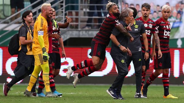 Champions Flamengo beat Palmeiras 3-1 in Brazil's Serie A Champions Flamengo beat Palmeiras 3-1 in Brazil's Serie A