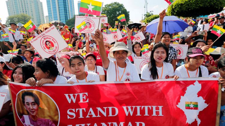 Suu Kyi’s loyalists rally for Myanmar leader before genocide trial