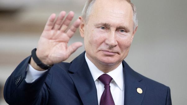Russia's Putin signs law to label people foreign agents Russia's Putin signs law to label people foreign agents