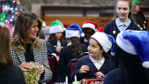 Melania Trump hands out Christmas presents to London children Melania Trump hands out Christmas presents to London children
