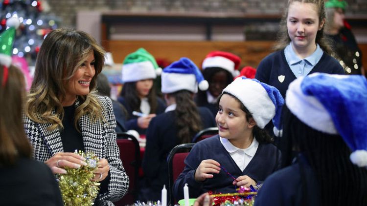 Melania Trump hands out Christmas presents to London children